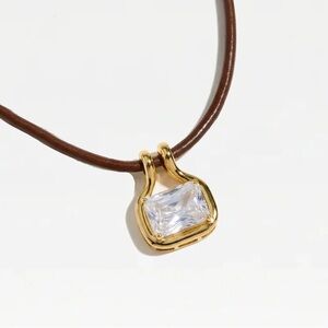 Gold Pendant Necklace with Clear Rectangular Crystal on Brown Cord